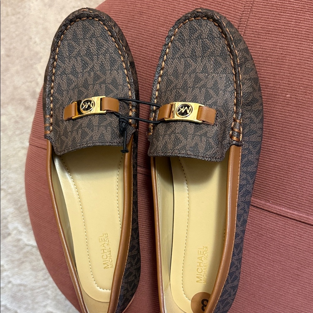 Brand new Michael Kors Dark Brown Loafers with Gold Detail